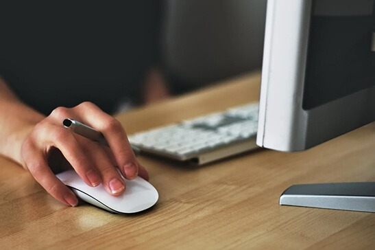 A designer working at a desk on a complex project.
